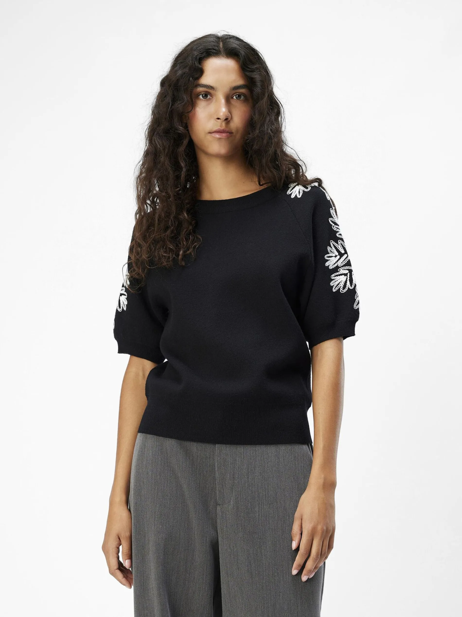 GEBORDUURD GEBREIDE TOP