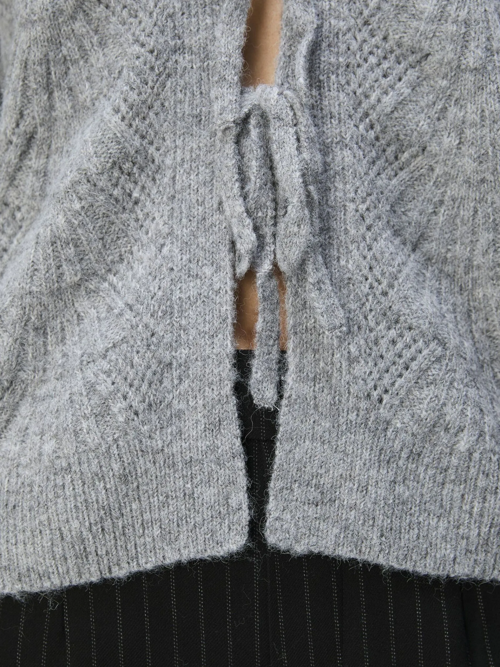 VOORKANT MET STRIKSLUITING VEST